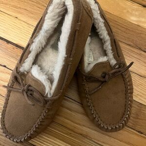 Ugg size 4 kids slippers. Worn but still have a lot of life left.